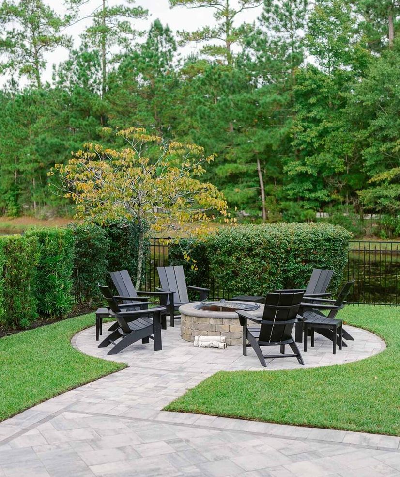 landscape redesign concrete seating area with firepit